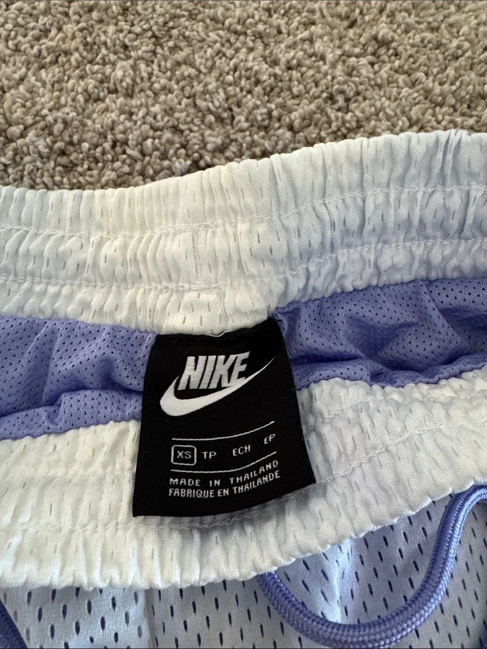 Nike Women's White Mesh Athletic Shorts with Lavender Drawstring